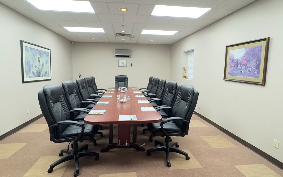 Cedar Conference Room board table set for 12 at Forest Inn in Sioux Lookout