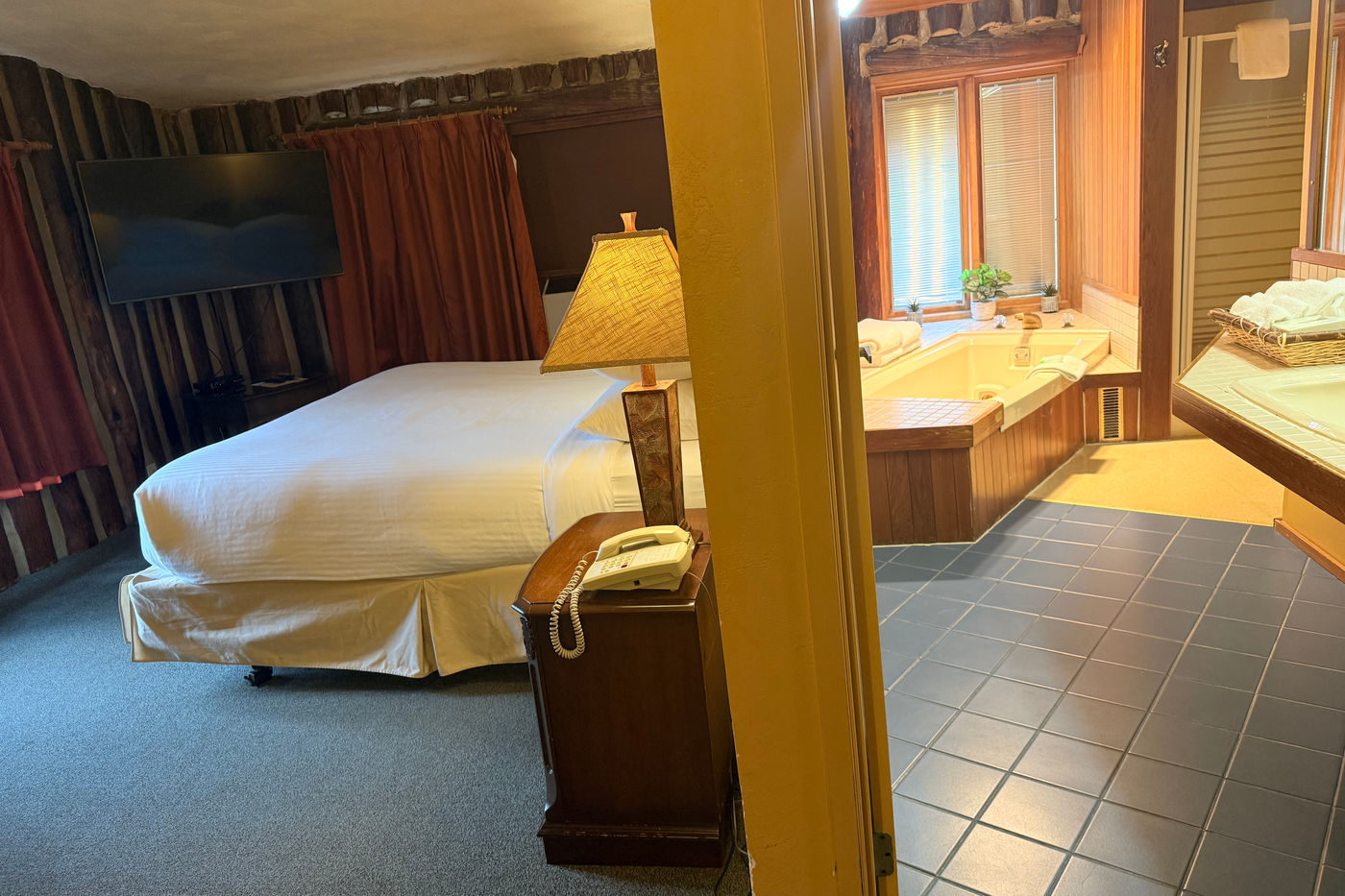 Deluxe log room at The Riverview Lodge with a king bed and Jacuzzi bathroom